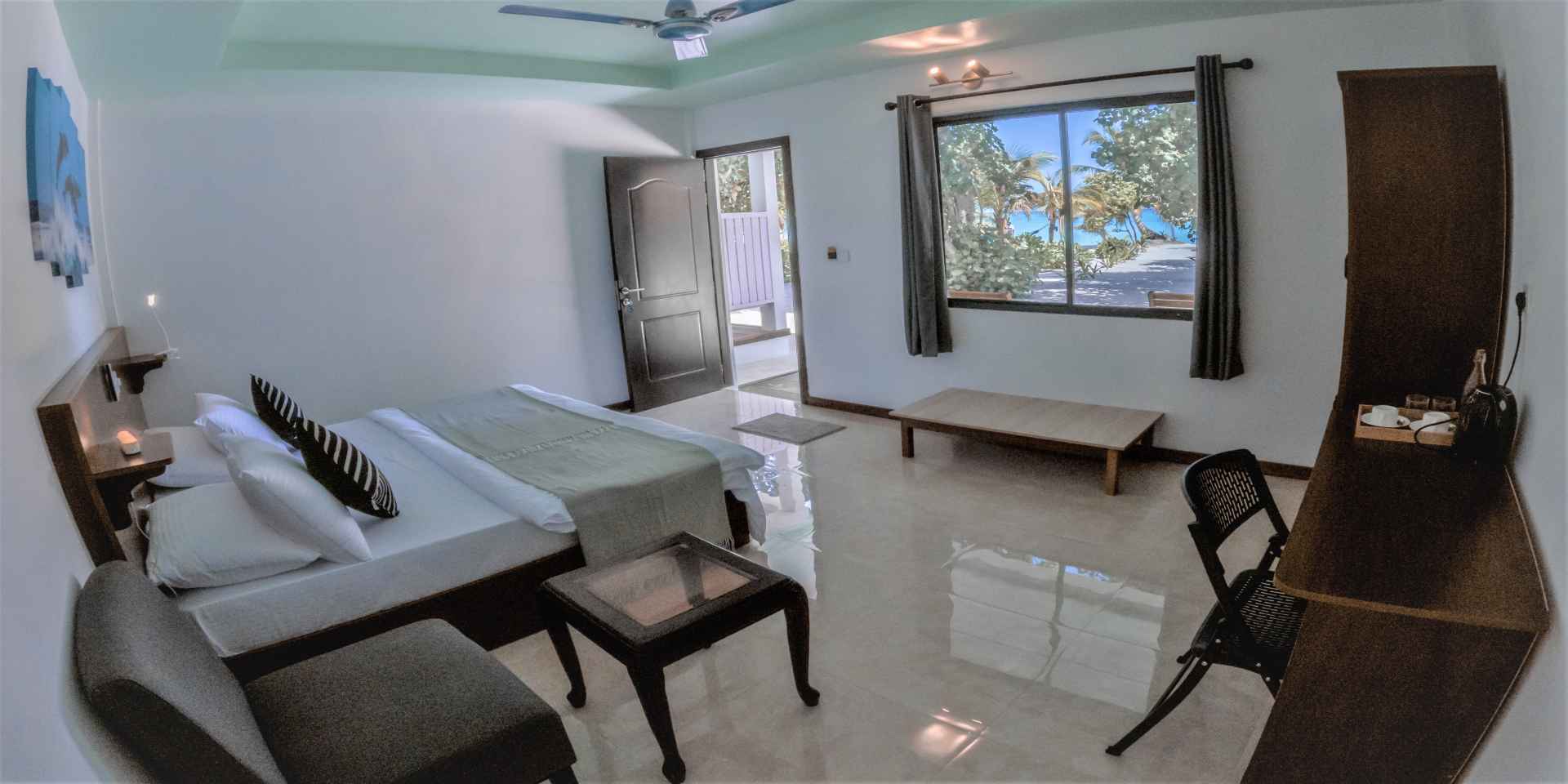 Relax in comfort in your room set just a few feet away from a beautiful beach